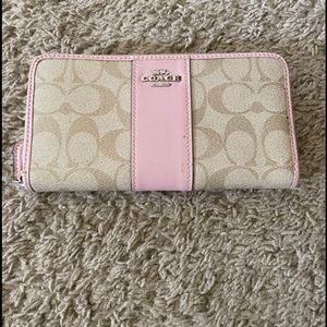 Pink and tan Coach wallet.